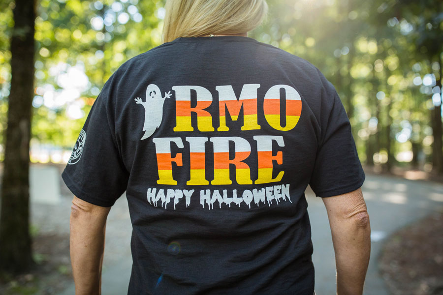 Woman wears Irmo Fire Halloween shirt